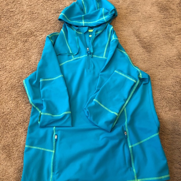 Kirkland Blue long Sleeve Front Zip Top with Hood. 85% Polyester, 15% Spandex. - Picture 5 of 6